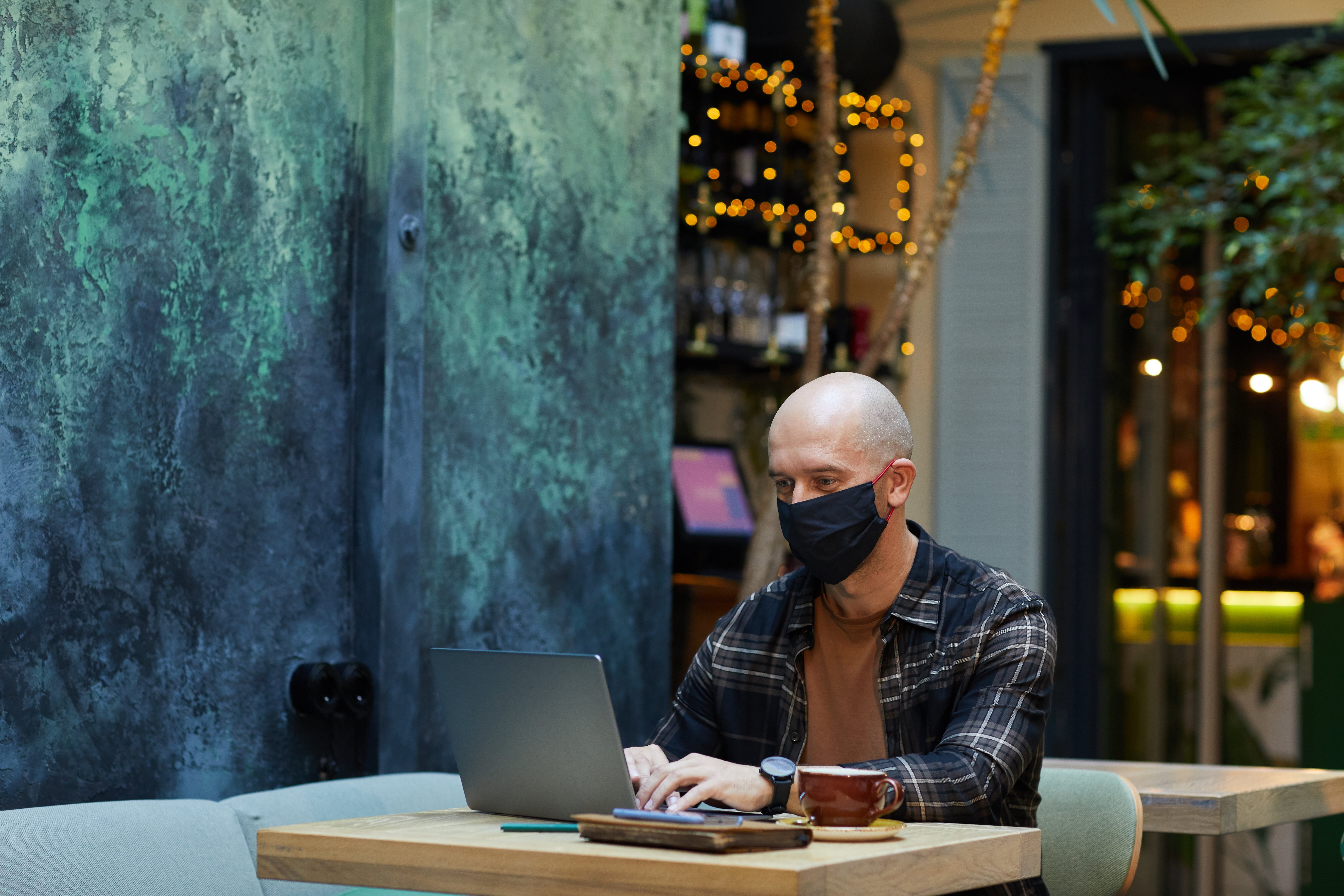 Man sitting in internet cafe